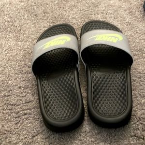Black and gray Nike slides lightly used good condition